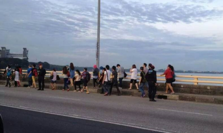 Workers Walk Across Johor-Singapore Causeway
